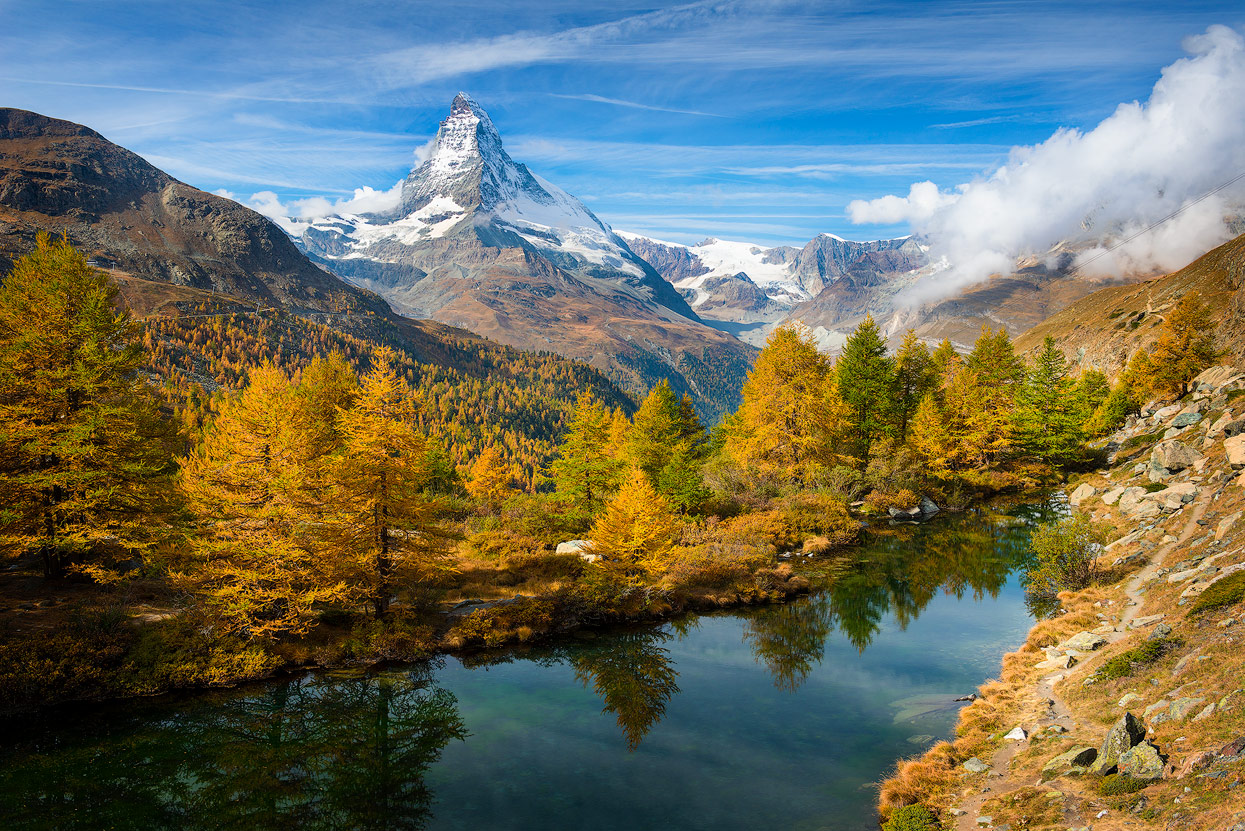 My favorite Viewpoint in October: Grindjisee in front of golden yellow firs and mount Matterhorn