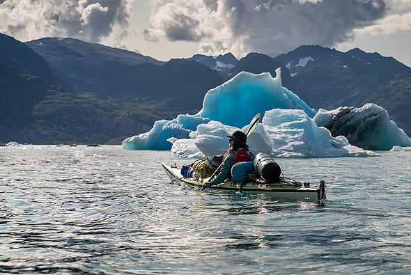 Kayaking along floating icebergs